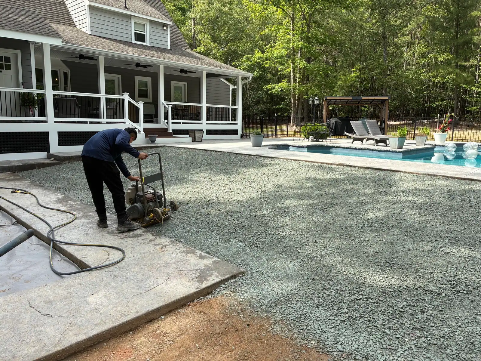 Watering and compacting the gravel base