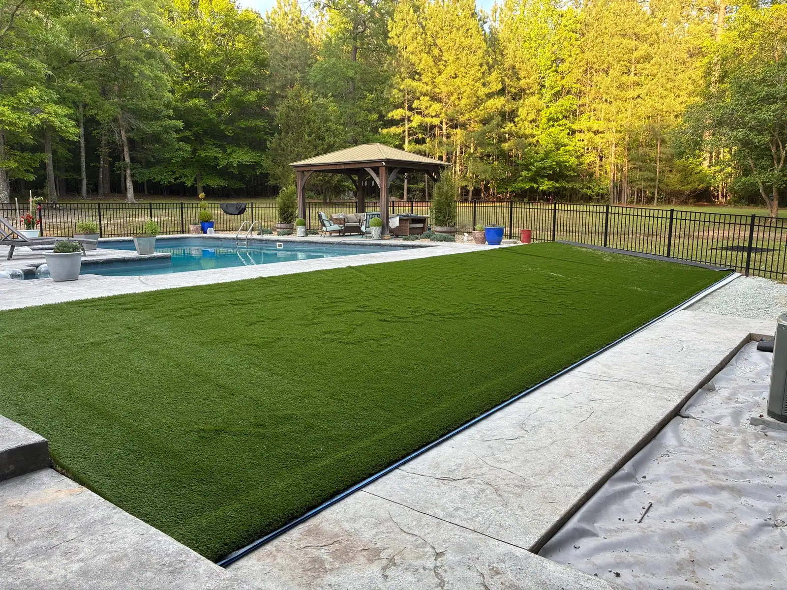 Finished artificial lawn around the pool