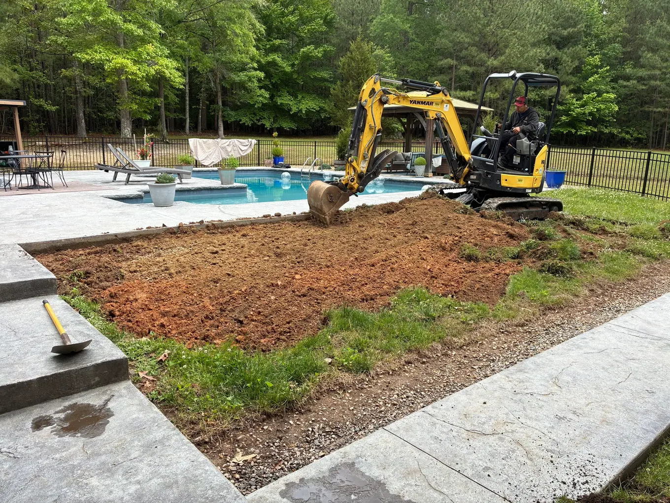 Preparing the lawn area between the house and pool