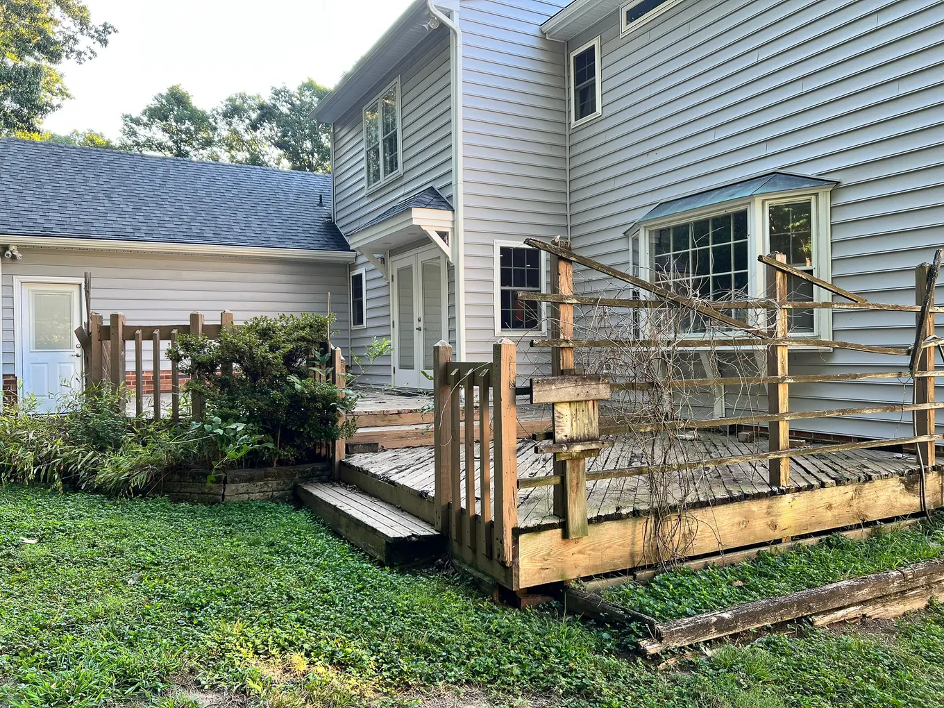 Original wooden deck beside the rear of the home