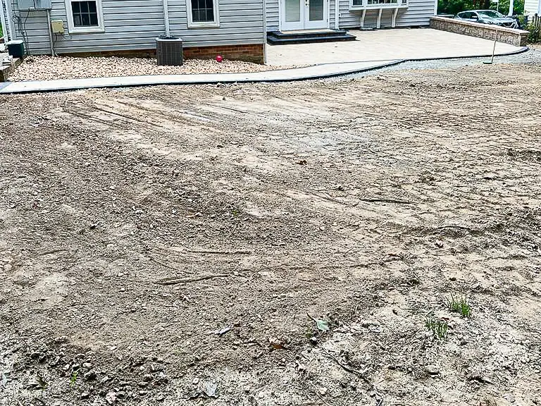 Completed patio viewed across the surrounding yard