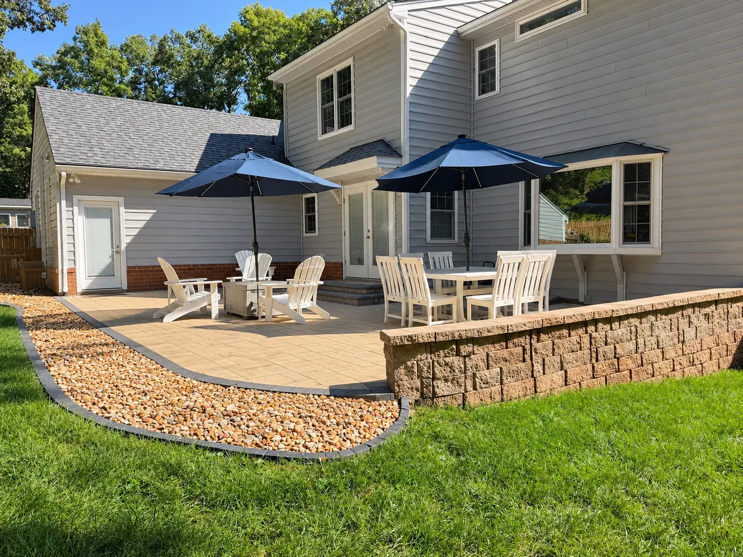 AI visualization of patio seating and landscaping beside the retaining wall