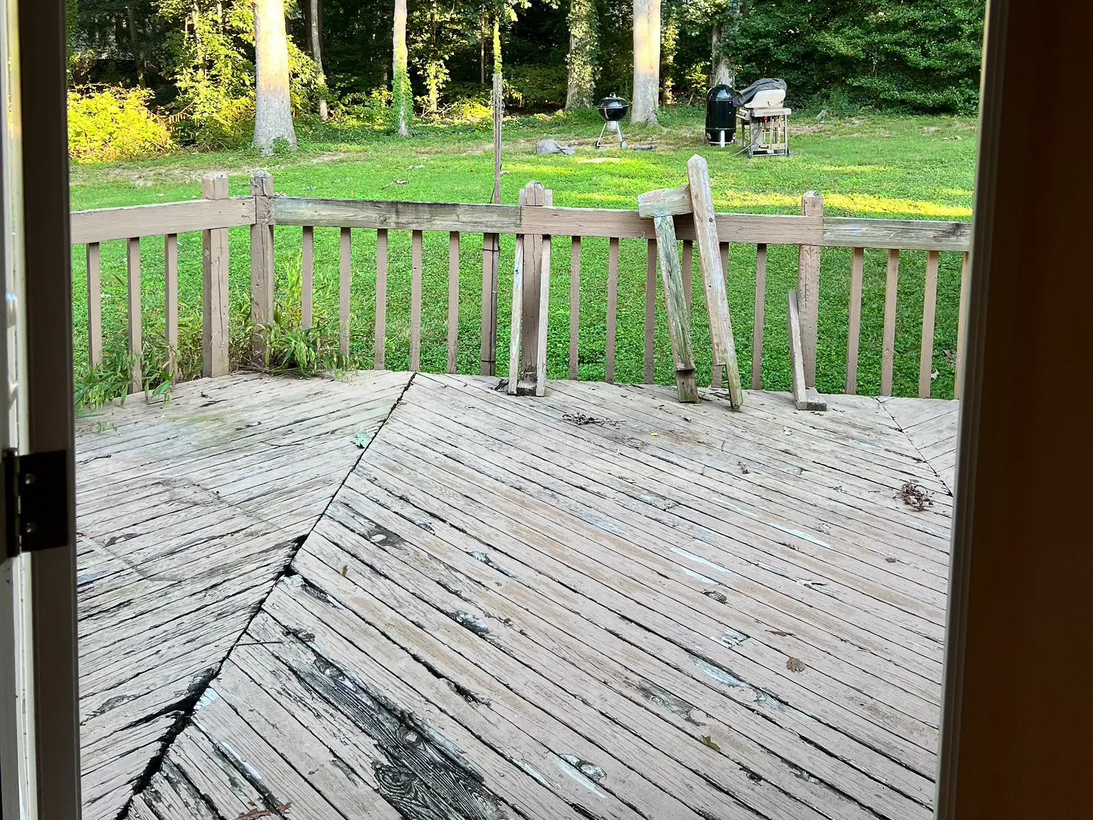 Weathered deck boards viewed from the rear doorway