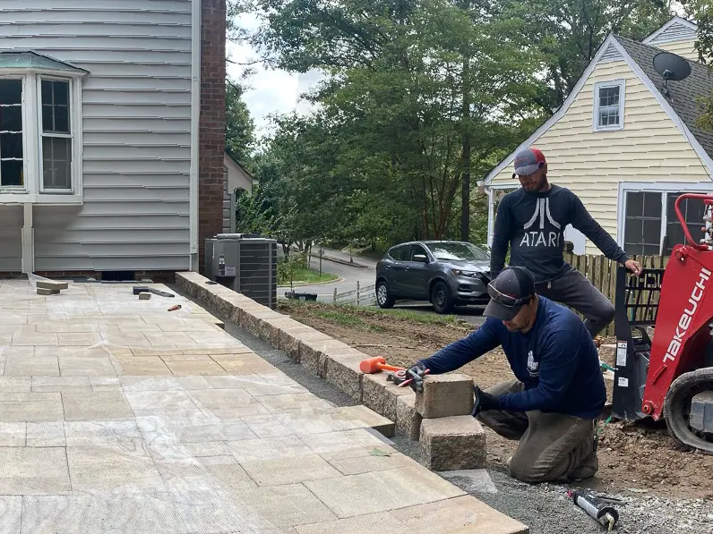 Patio base and retaining wall during construction