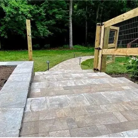 Steps connecting the entrance and curved walkway