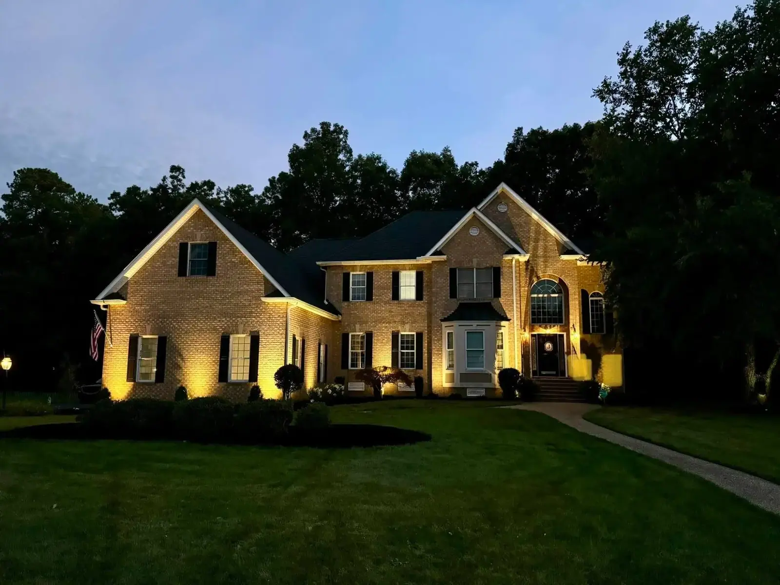 Home Lighting: Illuminated front facade at dusk