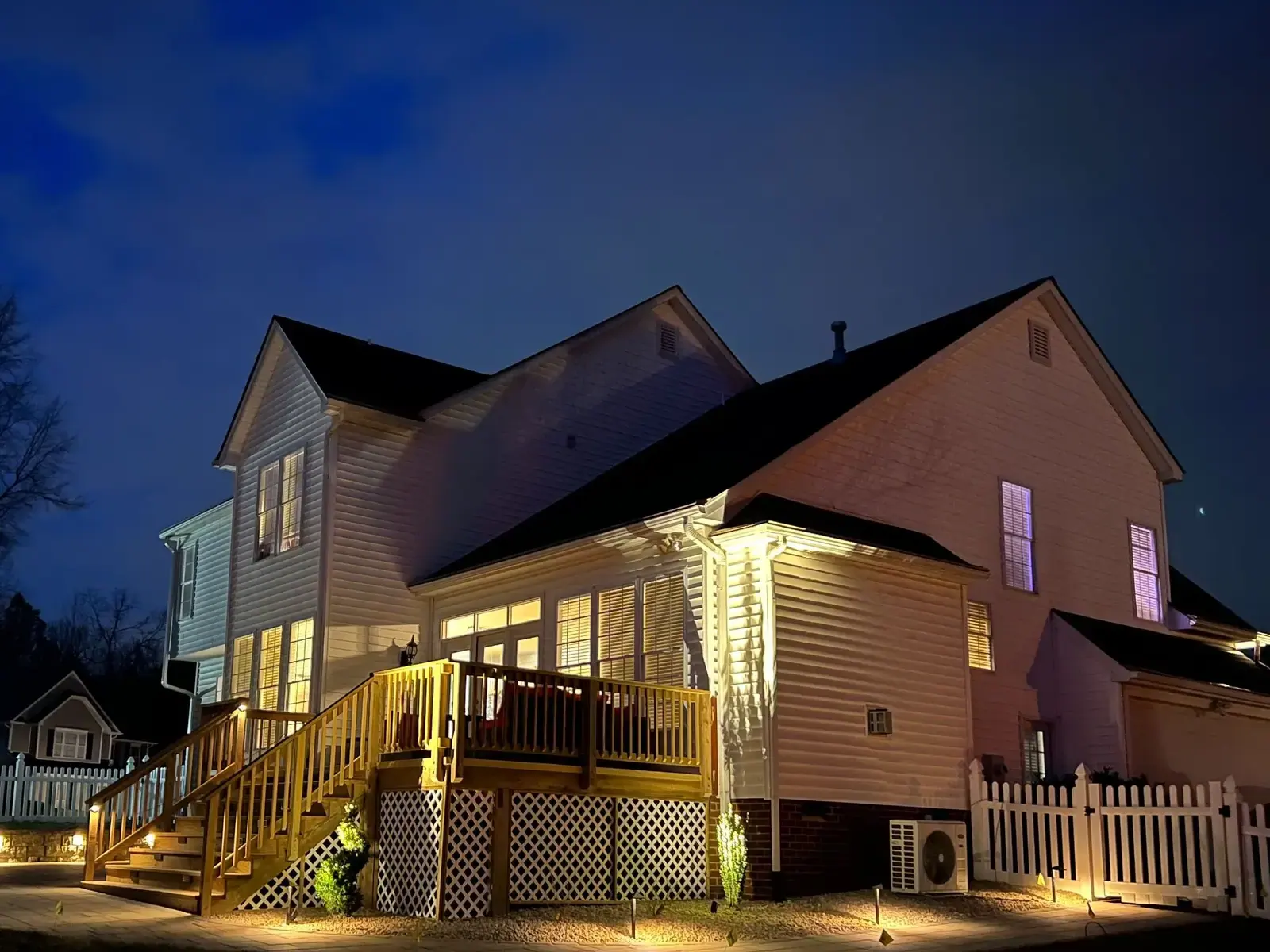 Rear deck and patio lighting at dusk