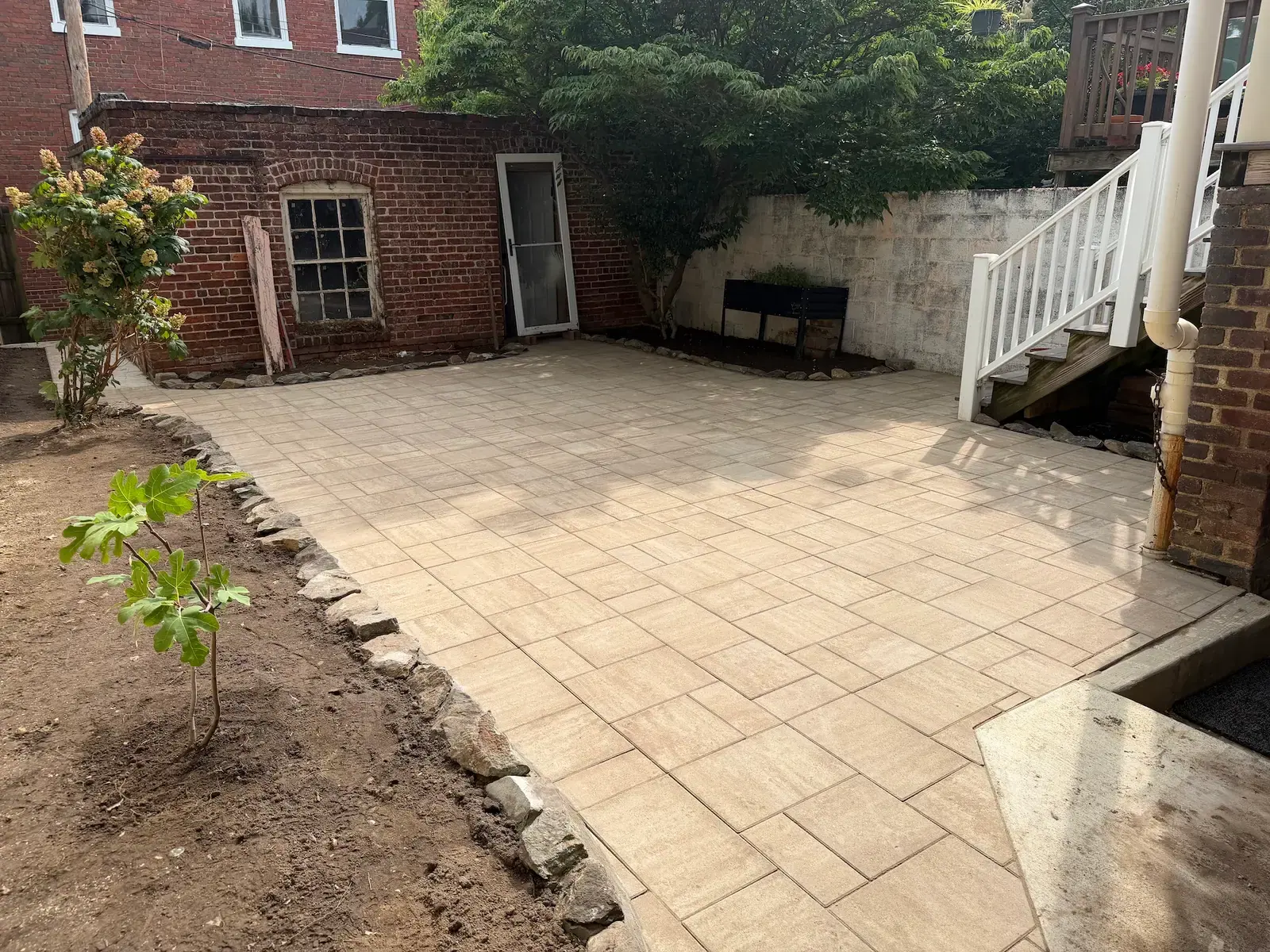 Paver patio surface before the garden beds were finished