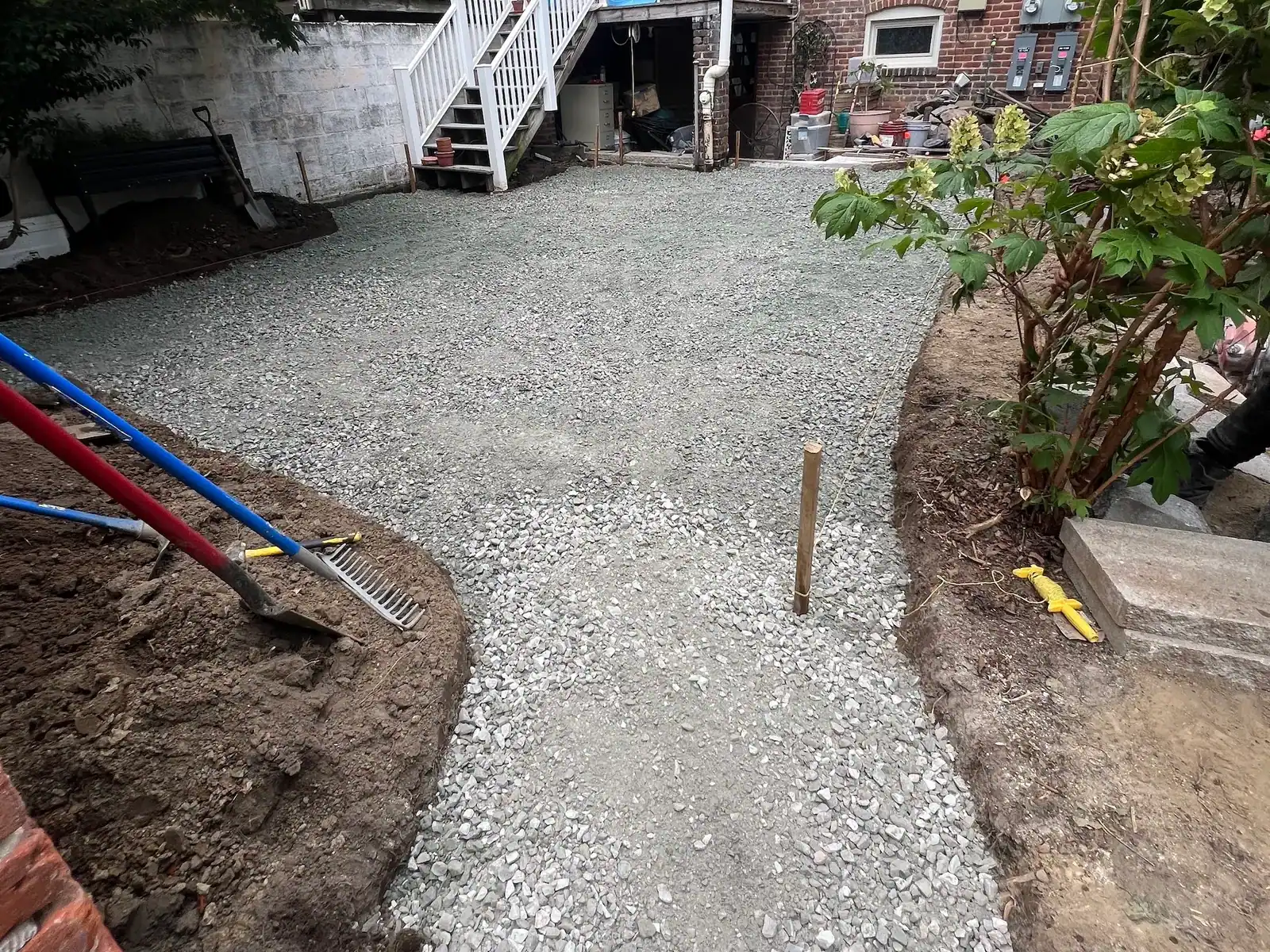 Prepared gravel path along the side of the home