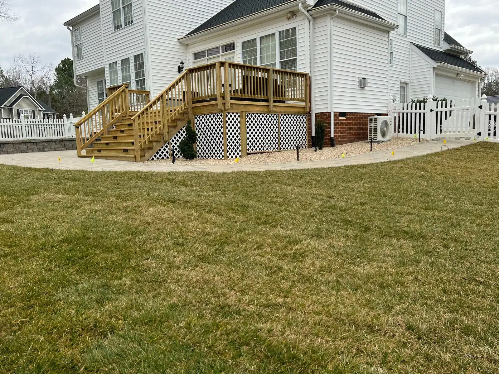 Rear deck, steps and surrounding lawn
