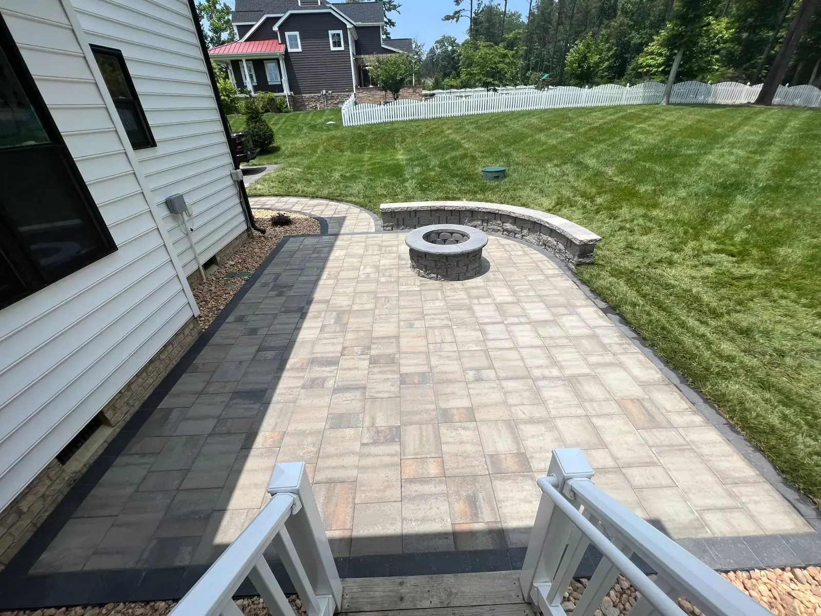Paver patio with a circular fire pit