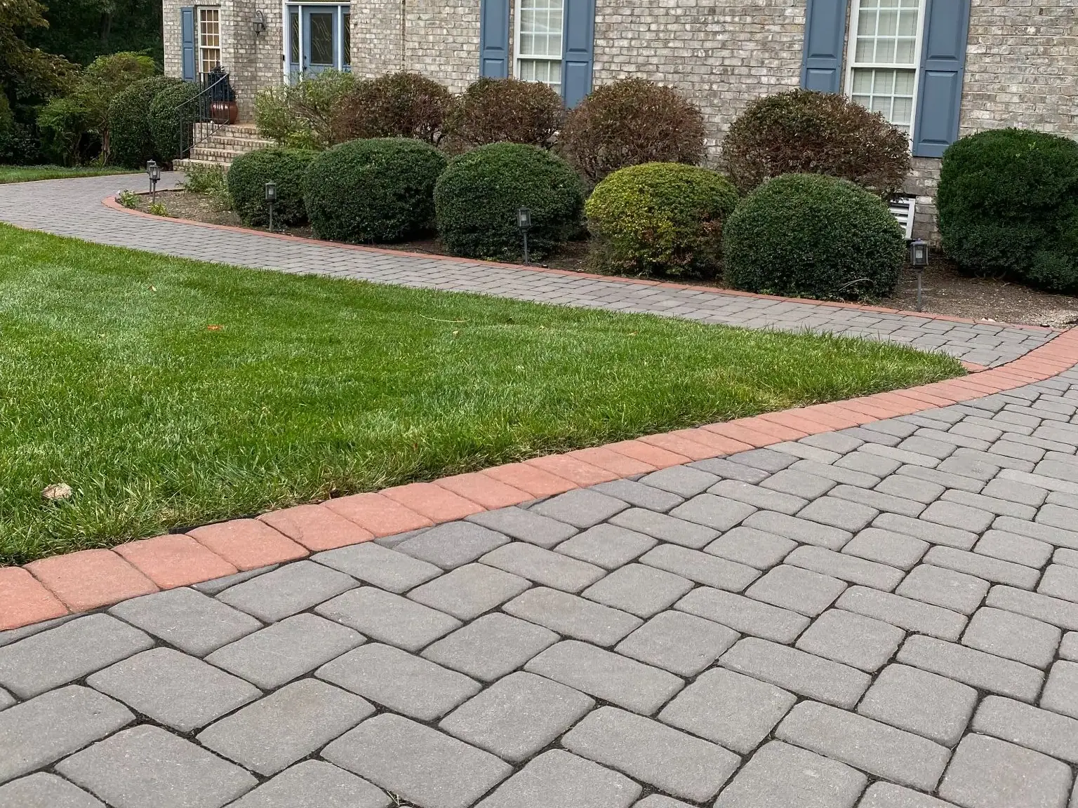 Driveway and planting along the front of the home