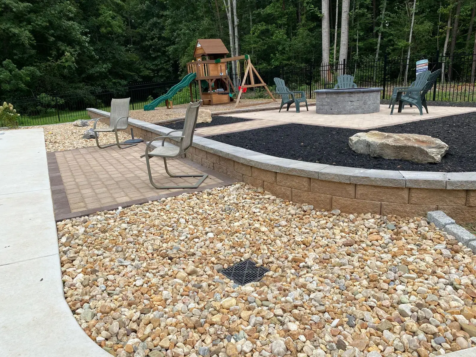 River rock along the poolside retaining wall