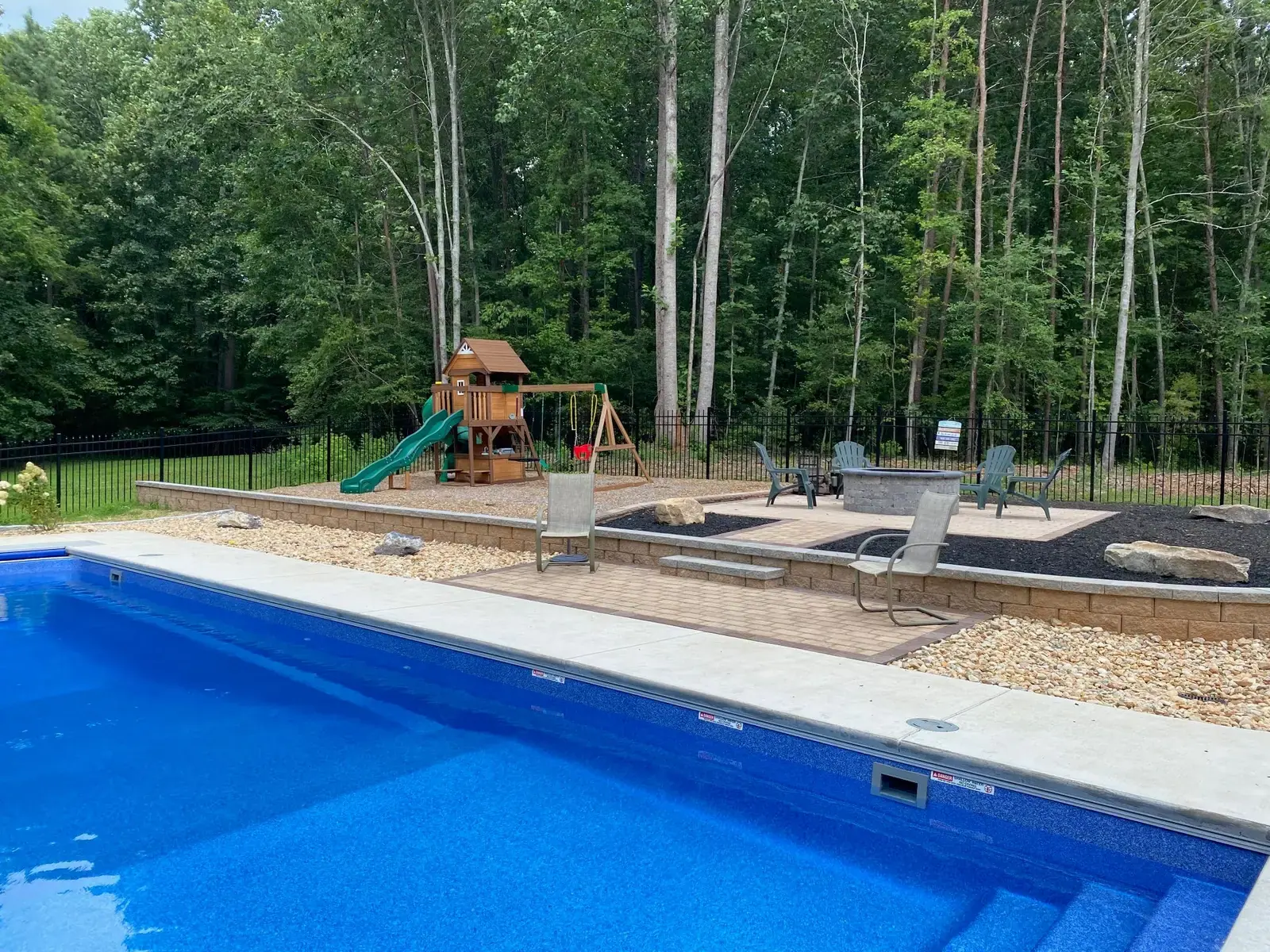 Poolside patio and fire pit