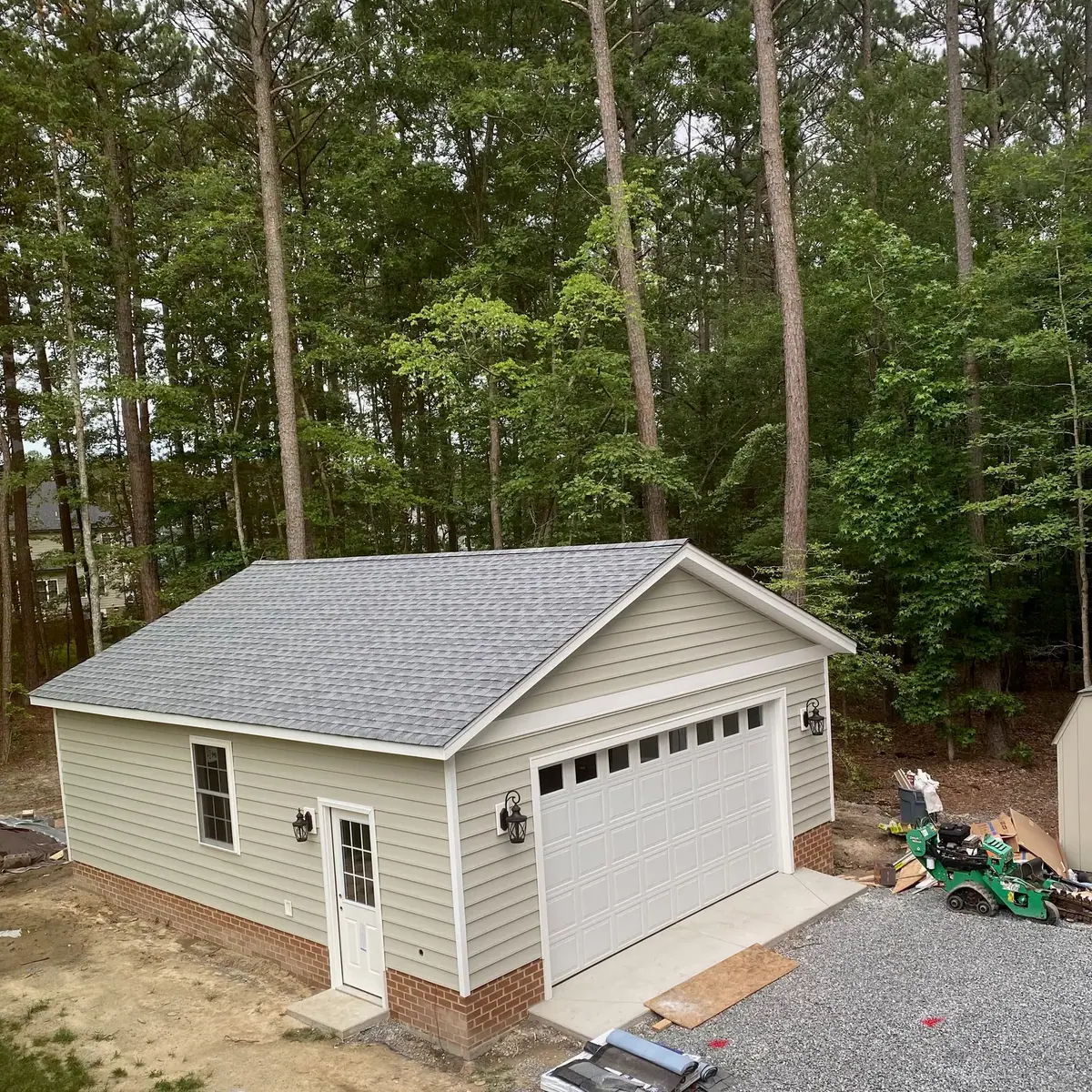 Finished garage shown for context; building not constructed by Willow Landscaping