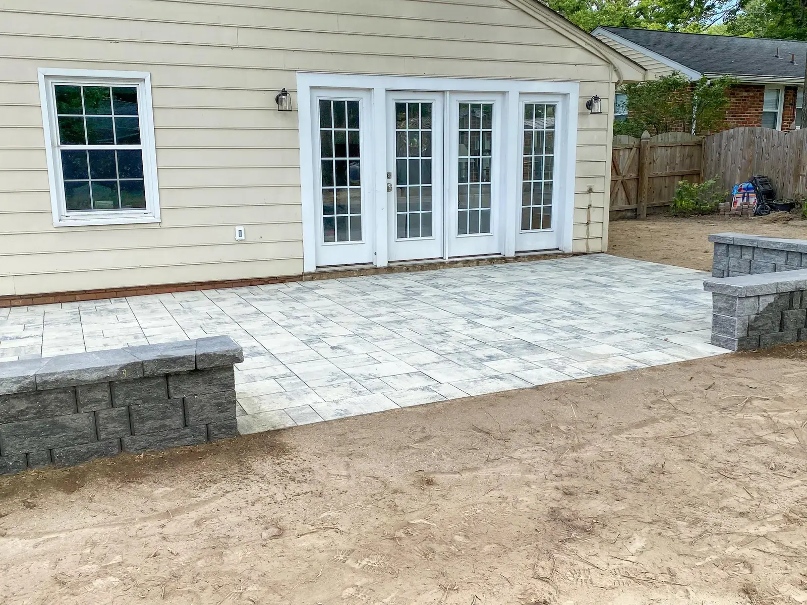 Open patio entrance between the low walls