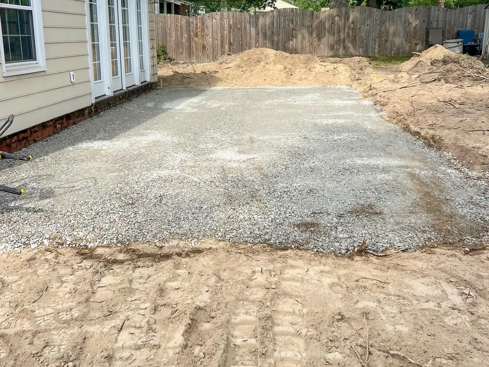 Gravel base laid out beside the rear doors
