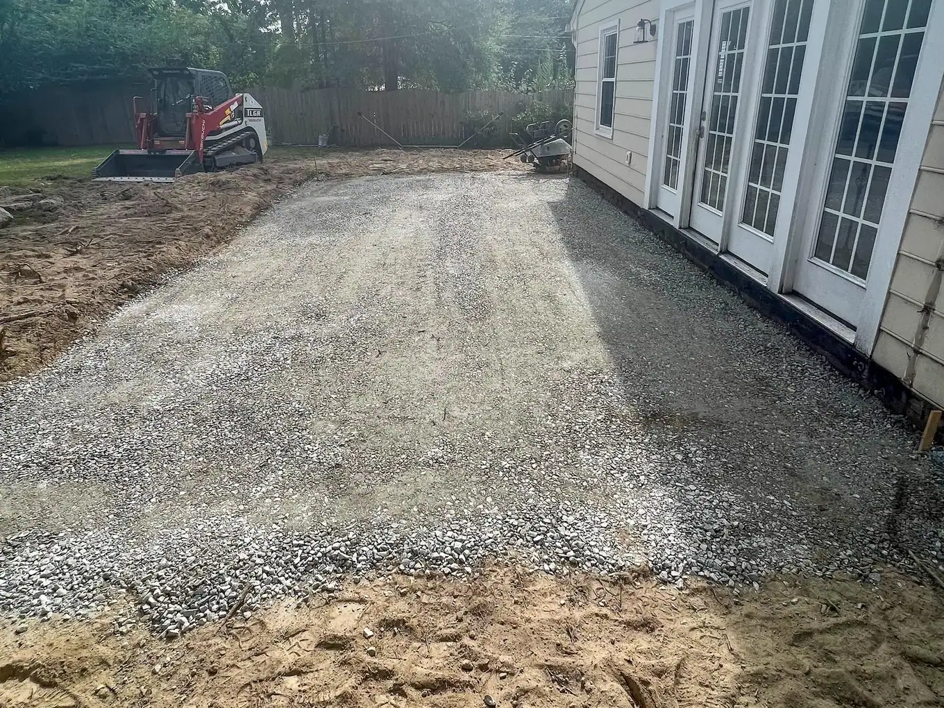 Prepared patio base and surrounding earthwork