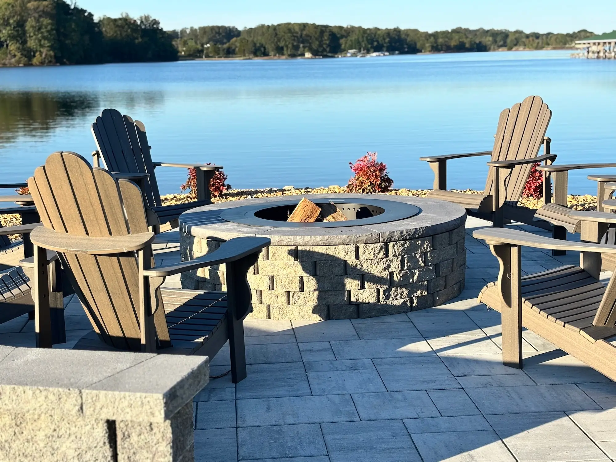 Completed Lakeside fire pit and paver patio overlooking the water